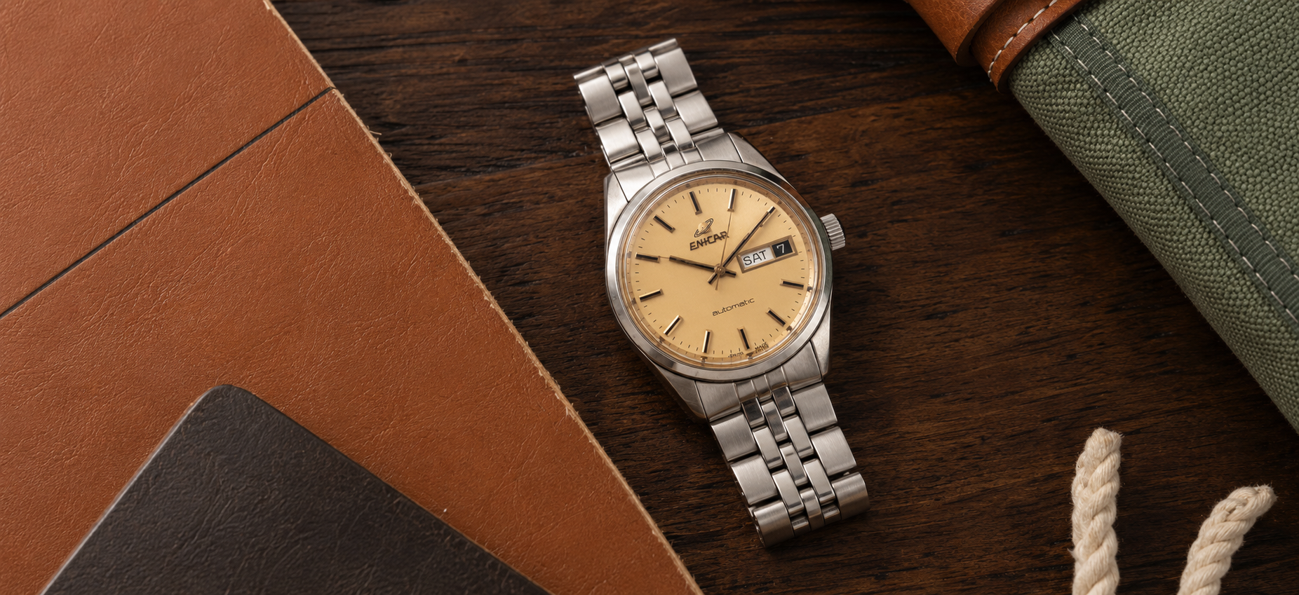 Vintage Enicar watch on a collector desk
